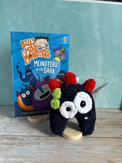 Navy Monster with Red horns and a Billy and the Mini Monsters Book
