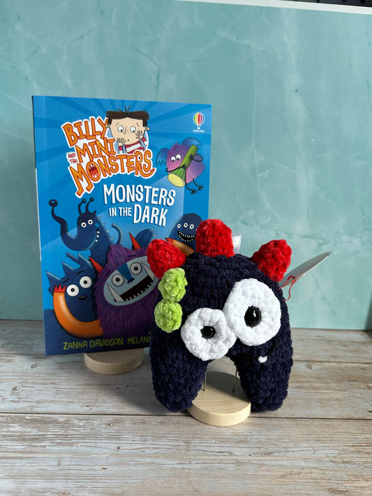 Navy Monster with Red horns and a Billy and the Mini Monsters Book